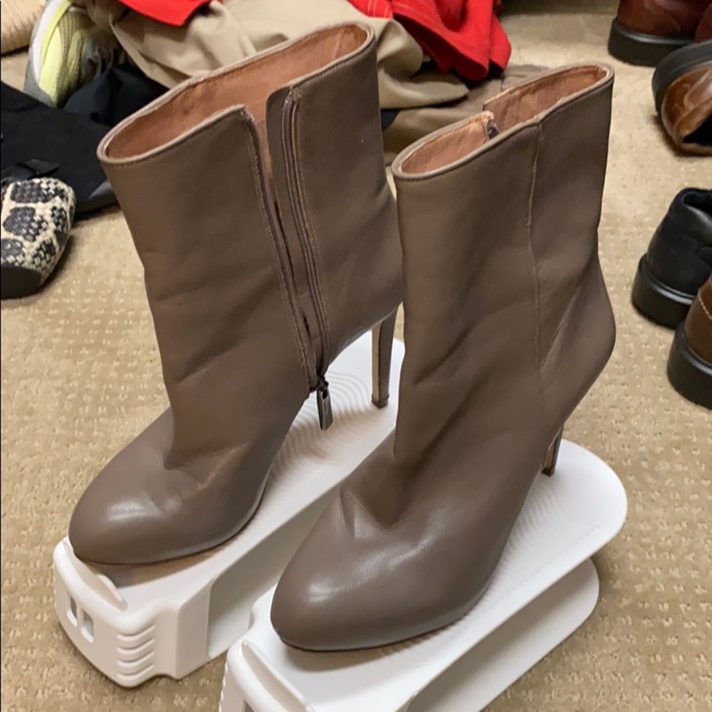 Taupe heeled booties. Soles have wear.